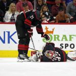 
              Carolina Hurricanes' Nino Niederreiter (21) checks on goaltender Antti Raanta (32) during the second period of Game 7 of an NHL hockey Stanley Cup second-round playoff series against the New York Rangers in Raleigh, N.C., Monday, May 30, 2022. (AP Photo/Karl B DeBlaker)
            