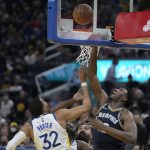
              Memphis Grizzlies forward Jaren Jackson Jr., right, drives to the basket against Golden State Warriors forward Otto Porter Jr. (32) during the second half of Game 4 of an NBA basketball Western Conference playoff semifinal in San Francisco, Monday, May 9, 2022. (AP Photo/Tony Avelar)
            