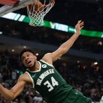 
              Milwaukee Bucks' Giannis Antetokounmpo is fouled as he makes a shot during the first half of Game 6 of an NBA basketball Eastern Conference semifinals playoff series Friday, May 13, 2022, in Milwaukee . (AP Photo/Morry Gash)
            