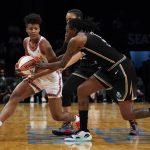 
              Connecticut Sun guard Yvonne Anderson, left, drives against New York Liberty forward Natasha Howard, right, in the second half during a WNBA basketball game, Tuesday, May 17, 2022, in New York. (AP Photo/John Minchillo)
            