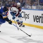 
              Colorado Avalanche's Nazem Kadri (91) and St. Louis Blues' Calle Rosen (43) chase after a loose puck along the boards during the first period in Game 4 of an NHL hockey Stanley Cup second-round playoff series Monday, May 23, 2022, in St. Louis. (AP Photo/Jeff Roberson)
            
