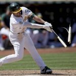 
              Oakland Athletics' Kevin Smith (1) breaks his bat for a single in the seventh inning of a baseball game against the Minnesota Twins in Oakland, Calif., on Wednesday, May 18, 2022. (AP Photo/Scot Tucker)
            