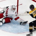 
              Boston Bruins' Taylor Hall (71) scores against Carolina Hurricanes' Pyotr Kochetkov (52) during the third period of Game 3 of an NHL hockey Stanley Cup first-round playoff series, Friday, May 6, 2022, in Boston. (AP Photo/Michael Dwyer)
            
