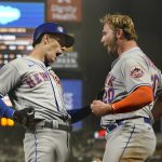 
              New York Mets' Mark Canha, left, is congratulated by Pete Alonso after hitting a home run against the San Francisco Giants during the eighth inning of a baseball game in San Francisco, Monday, May 23, 2022. (AP Photo/Jeff Chiu)
            