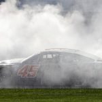 
              Kurt Busch (45) does a burnout after winning a NASCAR Cup Series auto race at Kansas Speedway in Kansas City, Kan., Sunday, May 15, 2022. (AP Photo/Colin E. Braley)
            