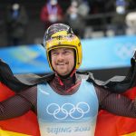 
              FILE - Johannes Ludwig, of Germany, celebrates winning the gold medal in luge men's single at the 2022 Winter Olympics, on Feb. 6, 2022, in the Yanqing district of Beijing. Ludwig announced his retirement Monday, May 16, 2022, on social media. (AP Photo/Pavel Golovkin, File)
            