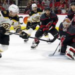
              Carolina Hurricanes goaltender Antti Raanta (32) snares the shot of Boston Bruins' Brad Marchand (63) during the first period of Game 5 of an NHL hockey Stanley Cup first-round playoff series in Raleigh, N.C., Tuesday, May 10, 2022. (AP Photo/Karl B DeBlaker)
            