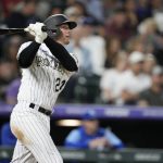 
              Colorado Rockies' Ryan McMahon watches his solo home run off Kansas City Royals relief pitcher Ronald Bolanos during the seventh inning of a baseball game Saturday, May 14, 2022, in Denver. (AP Photo/David Zalubowski)
            