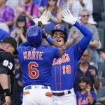 
              New York Mets' Starling Marte (6) and Mark Canha (19) celebrate after scoring nf Marte's two-run home run during the first inning of the team's baseball game against the Washington Nationals, Tuesday, May 31, 2022, in New York. (AP Photo/Mary Altaffer)
            