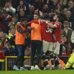 
              Manchester United's Cristiano Ronaldo, centre, celebrates after scoring his side's second goal during the English Premier League soccer match between Manchester United and Brentford at Old Trafford Stadium in Manchester, England, Monday, May 2, 2022. (AP Photo/Jon Super)
            