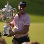 
              Justin Thomas holds the Wanamaker Trophy after winning the PGA Championship golf tournament in a playoff against Will Zalatoris at Southern Hills Country Club, Sunday, May 22, 2022, in Tulsa, Okla. (AP Photo/Sue Ogrocki)
            