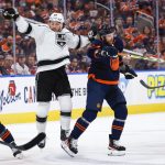 
              Los Angeles Kings left wing Brendan Lemieux, left, is checked by Edmonton Oilers defenseman Brett Kulak during the first period of Game 5 of an NHL hockey Stanley Cup first-round playoff series, Tuesday, May 10, 2022 in Edmonton, Alberta. (Jeff McIntosh/The Canadian Press via AP)
            