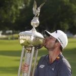 
              Sam Burns kisses the trophy after winning the Charles Schwab Challenge golf tournament at the Colonial Country Club in Fort Worth, Texas, Sunday, May 29, 2022. (AP Photo/LM Otero)
            