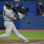 
              New York Yankees' Josh Donaldson hits an RBI double against the Toronto Blue Jays during the seventh inning of a baseball game Tuesday, May 3, 2022, in Toronto. (Nathan Denette/The Canadian Press via AP)
            