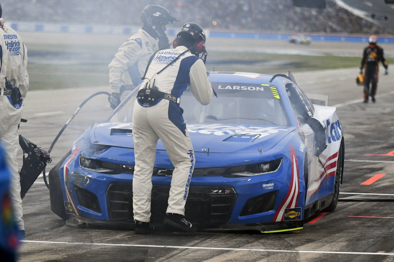 Kyle Larson (5) sits in pit row after crashing in the NASCAR All-Star auto race at Texas Motor Spee...