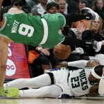 
              Milwaukee Bucks' Wesley Matthews fouls Boston Celtics' Derrick White during the second half of Game 3 of an NBA basketball Eastern Conference semifinals playoff series Saturday, May 7, 2022, in Milwaukee. The Bucks won 103-101 to take a 2-1 lead in the series. (AP Photo/Morry Gash)
            