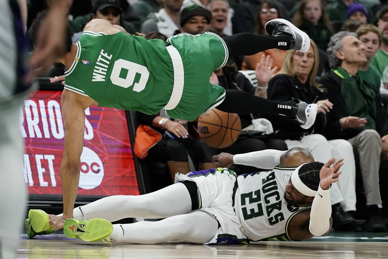 Milwaukee Bucks' Wesley Matthews fouls Boston Celtics' Derrick White during the second half of Game...