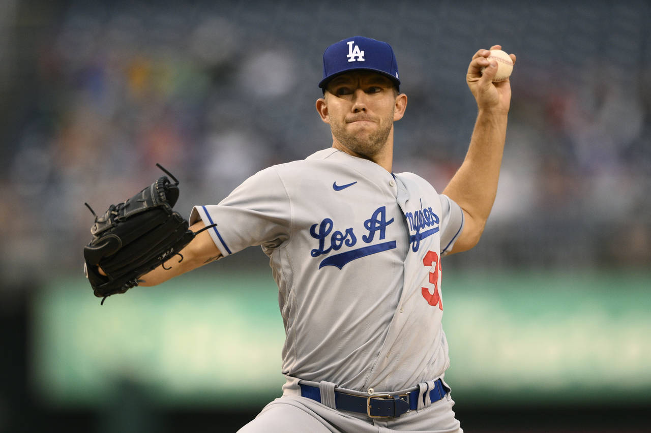 Los Angeles Dodgers starting pitcher Tyler Anderson throws during the first inning of a baseball ga...