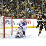 
              Pittsburgh Penguins' Danton Heinen (43) deflects the puck past New York Rangers goaltender Igor Shesterkin (31) for a goal during the second period in Game 4 of an NHL hockey Stanley Cup first-round playoff series in Pittsburgh, Monday, May 9, 2022. (AP Photo/Gene J. Puskar)
            