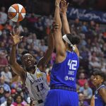 
              Los Angles Sparks forward Chiney Owgumika (13) shoots around Connecticut Sun center Brionna Jones (42) during a WNBA basketball game Saturday, May 14, 2022, in Uncasville, Conn. (Sean D. Elliot/The Day via AP)
            