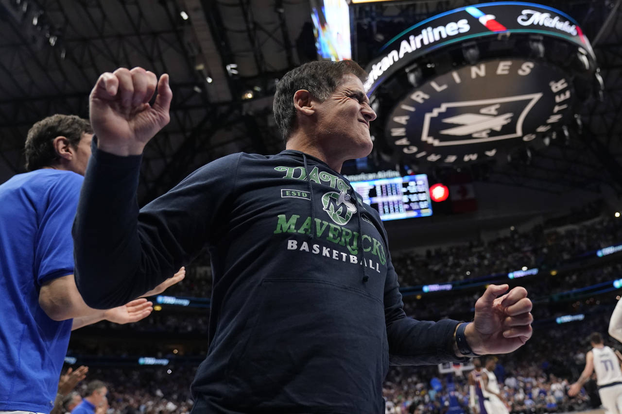 Dallas Mavericks owner Mark Cuban celebrates the team's win over the Phoenix Suns during in Game 3 ...