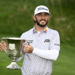 
              Max Homa holds the trophy after winning the Wells Fargo Championship golf tournament, Sunday, May 8, 2022, at TPC Potomac at Avenel Farm golf club in Potomac, Md. (AP Photo/Nick Wass)
            