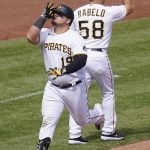 
              Pittsburgh Pirates' Daniel Vogelbach, left, celebrates with third base coach Mike Rabelo (58) as he rounds third after hitting a solo home run off Los Angeles Dodgers relief pitcher Daniel Hudson during the seventh inning of a baseball game in Pittsburgh, Wednesday, May 11, 2022. (AP Photo/Gene J. Puskar)
            