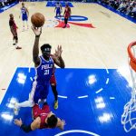 
              Philadelphia 76ers' Joel Embiid goes up for a shot against Miami Heat's Max Strus during the first half of Game 3 of an NBA basketball second-round playoff series, Friday, May 6, 2022, in Philadelphia. (AP Photo/Matt Slocum)
            