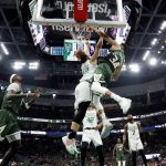 
              Milwaukee Bucks' Giannis Antetokounmpo dunks over Boston Celtics' Grant Williams during the second half of Game 6 of an NBA basketball Eastern Conference semifinals playoff series Friday, May 13, 2022, in Milwaukee. (AP Photo/Morry Gash)
            