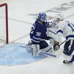 
              Tampa Bay Lightning right wing Corey Perry (10) scores on Toronto Maple Leafs goaltender Jack Campbell (36) during the second period of Game 2 of an NHL hockey Stanley Cup playoffs first-round series Wednesday, May 4, 2022, in Toronto. (Nathan Denette/The Canadian Press via AP)
            
