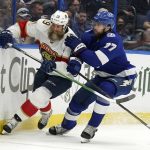 
              Florida Panthers center Joe Thornton (19) and Tampa Bay Lightning defenseman Victor Hedman (77) chase a loose puck during the first period in Game 4 of an NHL hockey second-round playoff series Monday, May 23, 2022, in Tampa, Fla. (AP Photo/Chris O'Meara)
            