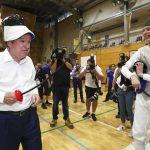 
              International Olympic Committee President Thomas Bach, left, gestures as he holds foil during fencing exhibition at the Olympics Unleashed session at the Yeronga Park Sports Centre in Brisbane, Australia, Saturday, May 7, 2022. Bach was in Brisbane on Saturday for the first time since the Queensland state capital was awarded the 2032 Olympics. (Jason O'Brien/AAP Image via AP)
            