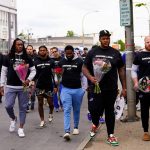 
              Members of the Buffalo Bills make their way to the scene of Saturday's shooting at a supermarket, in Buffalo, N.Y., Wednesday, May 18, 2022. (AP Photo/Matt Rourke)
            