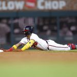 
              Atlanta Braves Ronald Acuna Jr. slides into second base in the ninth inning of a baseball game against the Philadelphia Phillies, Tuesday, May 24, 2022, in Atlanta. (AP Photo/Todd Kirkland)
            