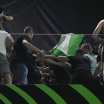 
              Fans scuffle at the Feyenoord fans tribune ahead of the Europa Conference League final soccer match between AS Roma and Feyenoord at National Arena in Tirana, Albania, Wednesday, May 25, 2022. (AP Photo/Thanassis Stavrakis)
            