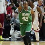 
              Boston Celtics center Al Horford (42) gestures after scoring during the first half of Game 7 of the NBA basketball Eastern Conference finals playoff series against the Miami Heat, Sunday, May 29, 2022, in Miami. (AP Photo/Lynne Sladky)
            
