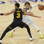 
              Dallas Mavericks guard Jalen Brunson, right, is defended by Golden State Warriors guard Jordan Poole (3) during the first half of Game 1 of the NBA basketball playoffs Western Conference finals in San Francisco, Wednesday, May 18, 2022. (AP Photo/Jeff Chiu)
            