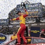 
              Joey Logano celebrates in Victory Lane after winning a NASCAR Cup Series auto race at Darlington Raceway, Sunday, May 8, 2022, in Darlington, S.C. (AP Photo/Matt Kelley)
            