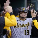 
              Pittsburgh Pirates' Daniel Vogelbach is greeted in the dugout after his 2-run home run during the ninth inning in the second baseball game of a doubleheader against the Detroit Tigers, Wednesday, May 4, 2022, in Detroit. (AP Photo/Carlos Osorio)
            