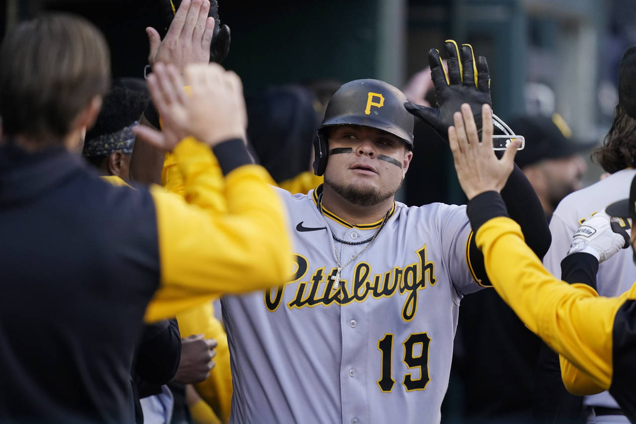Pittsburgh Pirates' Daniel Vogelbach is greeted in the dugout after his 2-run home run during the n...