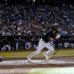 
              Arizona Diamondbacks' Jake McCarthy runs out an RBI triple during the second inning of a baseball game against the Los Angeles Dodgers, Saturday, May 28, 2022, in Phoenix. (AP Photo/Matt York)
            