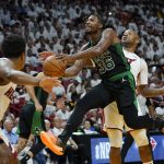 
              Boston Celtics guard Marcus Smart (36) drives to the basket as Miami Heat forward P.J. Tucker defends during the second half of Game 5 of the NBA basketball Eastern Conference finals playoff series, Wednesday, May 25, 2022, in Miami. (AP Photo/Lynne Sladky)
            