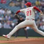 
              RETRANSMISSION TO CORRECT DAY AND DATE - Philadelphia Phillies starting pitcher Aaron Nola throws against the Seattle Mariners during the first inning of a baseball game, Tuesday, May 10, 2022, in Seattle. (AP Photo/Ted S. Warren)
            