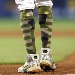 
              Miami Marlins' Jazz Chisholm Jr. wears camouflage socks on MLB Armed Force Day honoring members of the U.S. military during the fifth inning of a baseball game against the Atlanta Braves, Friday, May 20, 2022, in Miami. (AP Photo/Lynne Sladky)
            