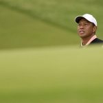 
              Tiger Woods lines up a shot on the 18th hole during the third round of the PGA Championship golf tournament at Southern Hills Country Club, Saturday, May 21, 2022, in Tulsa, Okla. (AP Photo/Matt York)
            
