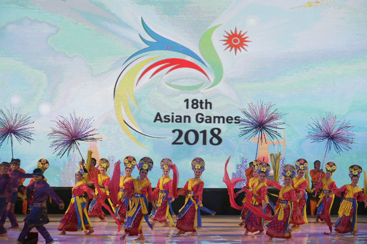 FILE - Traditional dancers perform during the unveiling of the logo of the 18th Asian Games in Jaka...