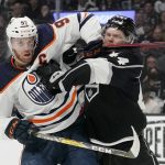 
              Edmonton Oilers center Connor McDavid, left, and Los Angeles Kings defenseman Mikey Anderson battle during the first period in Game 6 of an NHL hockey Stanley Cup first-round playoff series Thursday, May 12, 2022, in Los Angeles. (AP Photo/Mark J. Terrill)
            