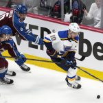 
              St. Louis Blues center Brayden Schenn, right, looks to control the puck as Colorado Avalanche defensemen Bowen Byram, front left, and Erik Johnson pursue during the first period of Game 5 of an NHL hockey Stanley Cup second-round playoff series Wednesday, May 25, 2022, in Denver. (AP Photo/David Zalubowski)
            