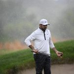 
              Jason Day of, Australia, line up a shot in the rain on the 16th hole during the second round of the Wells Fargo Championship golf tournament, Friday, May 6, 2022, at TPC Potomac at Avenel Farm golf club in Potomac, Md. (AP Photo/Nick Wass)
            