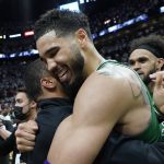 
              Boston Celtics forward Jayson Tatum (0) celebrates after winning Game 7 of the NBA basketball Eastern Conference finals playoff series against the Miami Heat, Sunday, May 29, 2022, in Miami. (AP Photo/Lynne Sladky)
            